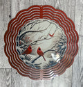 Wind Spinner Cardinals in snowy tree